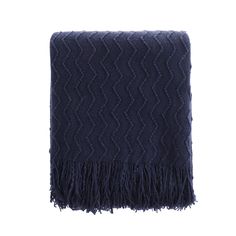 a dark blue blanket with fringes on it