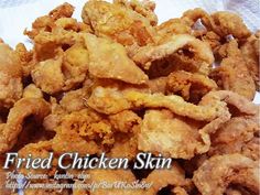 fried chicken skin is piled on top of a white paper towel with the words fried chicken skin above it