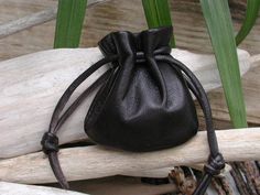 "This drawstring pouch bag is made with the finest soft and supple leather. Hand picked by me to ensure that you are getting the very best. When you hold this little gem in your hand, you will know what I mean. It will only get better year after year. So many uses...earbud holder, coins, wedding rings, crystals, gems, your lucky charms, etc. Color - Black Small Pouch size approx 3\"H X 3\"W. Pull drawstring to close at top Back to shop - http://www.etsy.com/shop/shirlbcreationstoo Read Customer Handmade Black Pouch For Everyday Use, Handmade Black Pouch As Gift, Everyday Handmade Black Pouch, Soft Leather Black Pouch As Gift, Soft Leather Gift Pouch, Black Soft Leather Pouch As Gift, Black Soft Leather Pouch For Gift, Soft Leather Pouch, Rosary Pouch