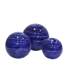 three blue vases sitting next to each other