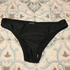 New Solid Black Bikini Bottom. Tag Says Xl But Fits More Like A Medium/Large. No Tag But Has Protective Liner Attached. Solid Color Party Swimwear Brief, Party Swimwear Briefs, Black Beach Bottoms With Lined Body, Black Swimwear Brief With Lined Body, Black Party Swimwear Briefs, Party Swimwear Briefs With Stretch, Stretch Party Swimwear In Brief Style, Solid Black, Womens Swim