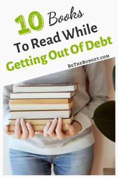 a woman holding books with the title 10 books to read while getting out of debt