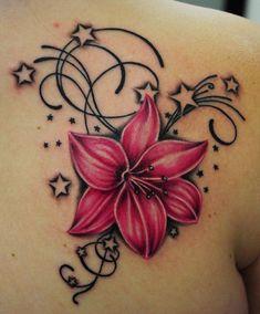 a woman's back with a pink flower and stars on it