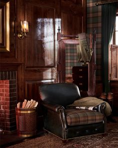 a chair and mirror in a room with wood paneling on the walls, carpeted floor