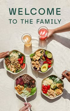 four people holding plates with food on them and the words welcome to the family above them