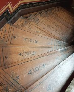 an old wooden staircase with intricate designs on it