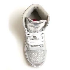 Sparkle with Glam Pie Glitter high top sneakers. Shimmering panels brighten up your athletic style in gold, silver, red, navy or black. This showstopping sneaker provides effortless style on or off the stage. 2 sets of laces Marshmallow Memory foam footbed Perforated leather upper for breathability Padded collar for ankle support Non marking soles 6 color combinations for pairing with any costume or uniform SKU: PK143302 FIT GUIDE: This shoe runs true to size.