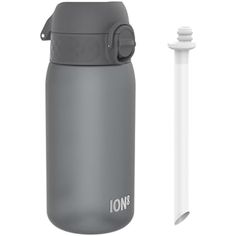 a gray and white water bottle next to an empty plastic tube with the word ion on it