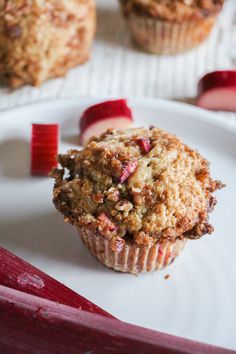 a muffin sitting on top of a white plate