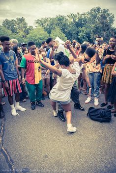 a group of young people standing around each other