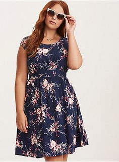 Allover florals bring life to a soft lightweight challis skater dress that has a cutout back and nipped-in waist.    Challis fabric  Crew neck  Short sleeves  Stretch waist  Fit and flare silhouette     CONTENT + CARE     Rayon  Wash cold; dry flat  Imported plus size dresses     SIZE + FIT     Model is 5’9”, size 1  Size 1 measures 39.5" from shoulder to hem Dress For Apple Shape, Plus Size Sundress, Floral Print Sundress, Weather App, Apple Shape, Open Back Dress, Eternal Sunshine, Open Back Dresses, Short Dresses Casual