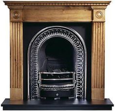 an ornate fireplace with a black mantle and gold trim