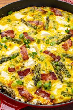 asparagus and bacon frittata in a red cast iron skillet