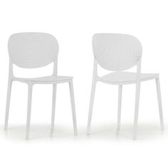 two white chairs sitting next to each other