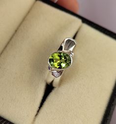 Peridot Oval Ring, Bezel set 6×8 Oval Peridot Ring in 925 sterling silver, Tilted Peridot Statement Ring, Peridot Ring with Wide Band O U R P R O M I S E + + + + + + + + + + + + + We believe that it is the importance to ensure that our each and every customer are satisfied with what they bought from us. Till now each and every sales we made we keep our customer satisfied as our customers near and dear to our hearts and sure your shopping experience is unforgettable We work with precision. Emotion that brings sweet smile in your face. Emotion that shows togetherness in each and every part of the . We are a team of dedicated professionals who use to work with precision, creating every order with their hands with excitement and love! But we know that with you we are incomplete, so its all abo Oval Peridot Ring In White Gold, Oval Peridot Solitaire Jewelry, Oval Peridot Hallmarked Ring, Oval Peridot Gemstones For Anniversary, Silver Gift Wrap, Flower Girl Gifts, Oval Rings, Peridot Ring, Engraved Gifts