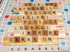 a scrabble board with words written on it