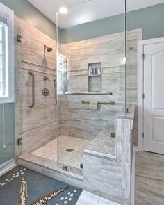 a bathroom with a walk in shower next to a sink