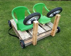 two green plastic chairs on wooden pallets with wheels attached to the back and sides