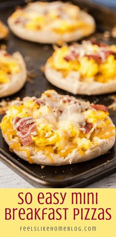 mini breakfast pizzas on a baking sheet with text overlay