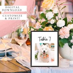 a table with flowers, wine glasses and a sign that says table 7 on it