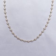 This exquisite 3 3/4 Carat round moissanite diamond necklace features a delicate link chain and a bezel-set design. Expertly crafted with lab-created diamonds in 10K or 14K solid gold and 925 sterling silver, this piece radiates luxury and sophistication. The perfect addition to elevate any outfit. Model No : CSSN1523