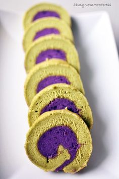 purple and green rolls on a white plate