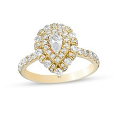 a yellow gold ring with an oval shaped diamond surrounded by smaller round diamonds on the band