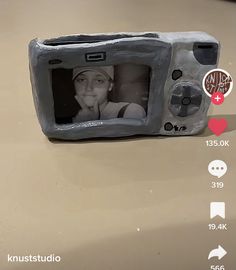 a camera with an image of a child on it's screen is shown in the bottom right hand corner