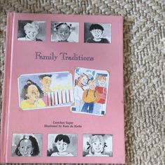 a pink book with pictures of children's faces on it sitting on a carpet