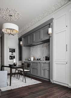 a modern kitchen with gray cabinets and white marble counter tops is pictured in this image