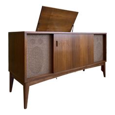 the sideboard is made out of wood and has an open box on it's top