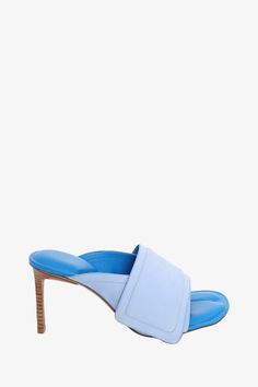 Jacquemus Blue Leather 'Les Mules Aqua' Heeled Sandals. Slip-on. Round open toe. Tonal stitching Original Retail Price: $750Size: 37 IT (7 US)Heel Height: 3.25Condition: This item is in fair pre-loved condition with visible signs of wear throughout. Wear on sole. Minor discolouration and pilling on suede strap. Loose strap seam Aqua Heels, Mens Spring Shoes, Pop Clothing, Iconic Bags, Love Blue, Heeled Loafers, Spring Shoes, Heeled Sandals, Shoe Sale