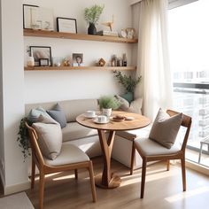 a living room filled with furniture next to a large window covered in windowsills