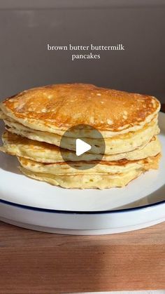 a stack of pancakes on a plate with the words brown butter buttermilk pancakes