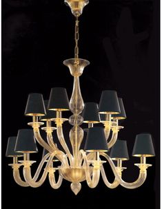 a chandelier with six shades of black on the bottom and one light in the middle