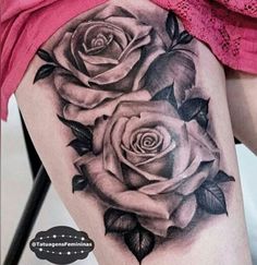 a woman's thigh with roses on it