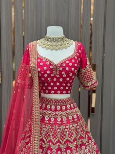 Valentine red intricate in blush floral thread embroidery with pearl, sequence, zari, zardozi and cut dana work lehenga. Completed look with similarly embroidered blouse and net blouse. Celebrate your luxurious moment in this valentine red color designer silk lehenga. Fabric: Raw Silk Size: 38/M Occasion: Wedding Ceremony or Reception. WASH CARE INSTRUCTIONS - Please Dry clean only when it is applicable. Slight color variation is possible due to digital photography. Ready to Ship! Dola Silk Anarkali Set With Dori Work For Reception, Dori Work Dola Silk Anarkali Set For Reception, Embroidered Lehenga For Reception Navratri, Embroidered Lehenga For Reception And Navratri, Embroidered Lehenga For Reception During Navratri, Raw Silk Sets With Dori Work For Reception, Dola Silk Sets With Pallu For Reception, Kundan Embroidered Fabric For Reception, Festive Silk Thread Lehenga