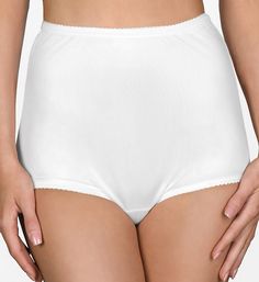 This classic nylon brief panty features a flexible fit that molds to your curves for the perfect fit. Flat elastic along waist and leg openings for less bulk. High rise. Full rear coverage. Sewn-in crotch. Shadowline's nylon tricot fabric is made in the US. Please Note: This panty is made of Satintrique 100% nylon satin tricot knit, which has a satin sheen. Shadowline Women's Pants & Daywear Nylon Classic Brief Panty in White | Size 5 | HerRoom.com Eileen West, Tricot Fabric, High Waisted Briefs, Lingerie For Men, Lace Inset, Vintage Lingerie, Vintage Style Outfits, Briefs, Women's Pants