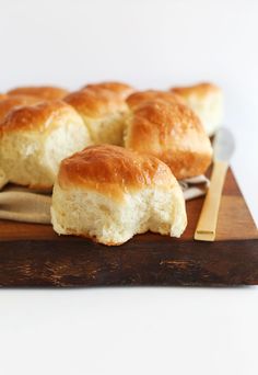 several pieces of bread sitting on top of a cutting board