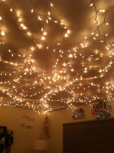 the ceiling is decorated with lights and pictures