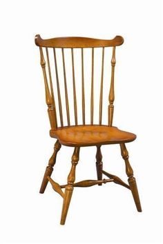 an old fashioned wooden chair against a white background