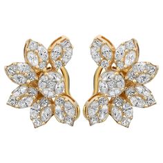 These charming flower earrings evoke the beauty of springtime blooms. Beautifully crafted in lustrous 14k yellow gold, the earrings are encrusted with prong-set marquise and princess-cut diamonds weighing 2.96 carats. The diamond quality is color I-J and clarity SI. The earrings measure 0.8 inches x 0.5 inches and weigh a total of 6.80 grams. They are secured with a push-back post closure. These earrings are the perfect accessory to complement your outfit or to gift to a loved one. Comes with an appraisal and a presentable gift box. White Gold Earrings Studs, White Gold Studs, Colorless Diamond, Flower Stud Earrings, Princess Cut Diamond, Flower Stud, Diamond Drops, Diamond Flower, Flower Earrings Studs