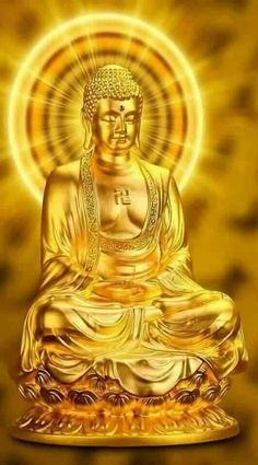 a golden buddha statue sitting in the middle of a room with sunlight streaming through it