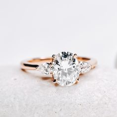 an engagement ring with three stones on top