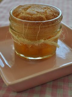 a glass jar filled with food sitting on top of a plate