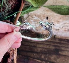 Vintage Kabana Horse Bracelet Sterling Silver Double Head Wild Horse Cowgirl Bypass Bangle Bracelet Horse Lover Gift Horse Jewelry MINT Just gorgeous Kabana bracelet is magnificent! This RARE sought after heavy cuff bracelet has 2 wild stallion horse heads with long wavy manes.  It measures 2 1/2" in width on the interior, and 1/2" in height.  Fits a medium wrist comfortably.  This is a substantial piece. The bracelet bends slightly to put on.  In perfect vintage condition!  Received as a gift, Adjustable Bracelet With Polished Finish As A Gift, Adjustable Polished Finish Bracelets As Gifts, Adjustable Bracelets With Polished Finish For Gifts, Adjustable Polished Bracelet - Perfect Gift, Polished Finish Adjustable Bracelet As Gift, Wild Stallion, Stallion Horse, Horse Heads, Horse Bracelet