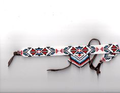 a white belt with red and blue designs on it