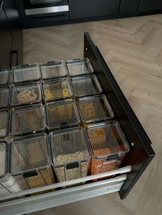 the drawers are filled with containers and food