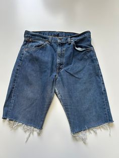 Ladies Levis Denim Short cut off Mid Stonewash Waist 32 inch Length 11 inch Vintage 1990s Made Denim Item in excellent Condition Casual Dark Wash Reworked Bottoms, Casual Reworked Dark Wash Bottoms, Casual Reworked Medium Wash Bottoms, 90s Cutoff Jeans With Pockets, Vintage Dark Wash Straight Leg Jean Shorts, Vintage Straight Leg Dark Wash Jean Shorts, Casual Reworked Faded Bottoms, 90s Style Cutoff Jeans In Denim Blue, Vintage Cut-off Jeans For Streetwear