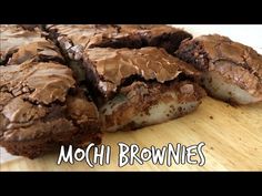 chocolate brownies cut in half on top of a wooden cutting board with the words mochi brownies